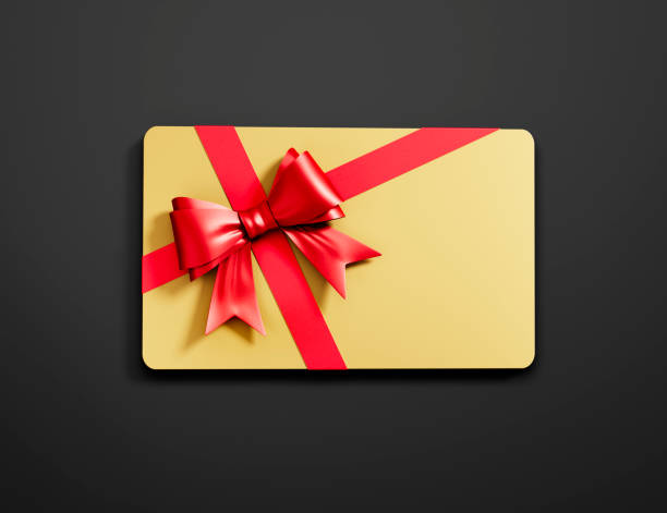 Golden Gift Card with red tied Bow on dark Background